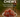 Bowl of red energy chews promoting portable, easy-to-digest running fuel with a blurred runner in background.